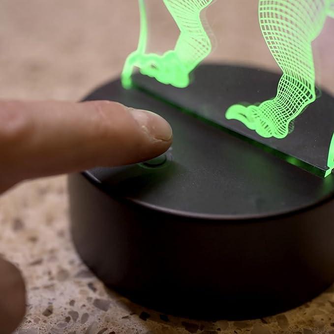 dettaglio pulsante accensione lampada led 3d dinosauro su base nera
