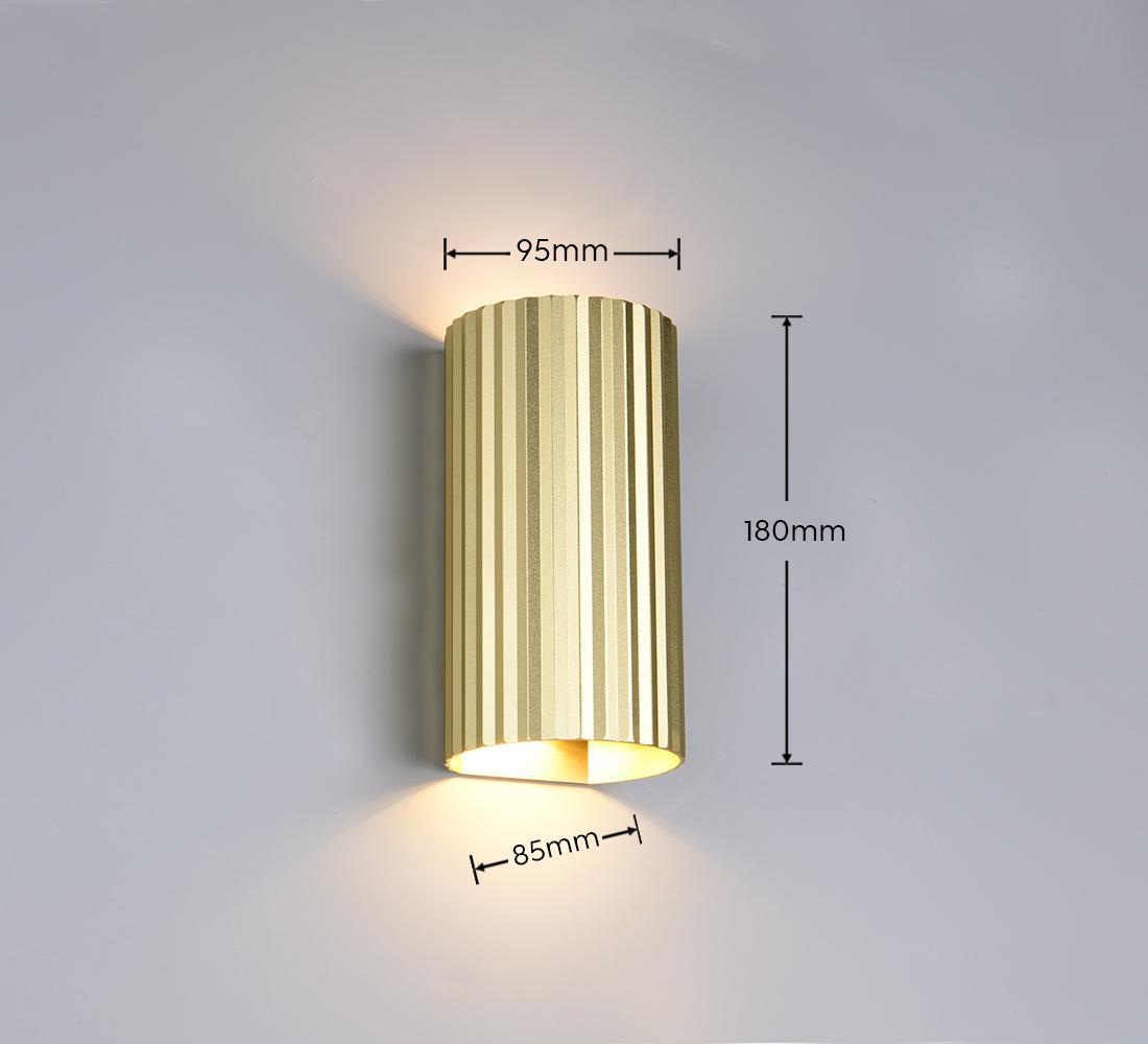 applique da parete oro rigata con emissione luminosa verso alto e basso